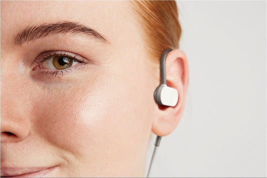 A person wearing Nuropod, a wearable vagus nerve stimulation device